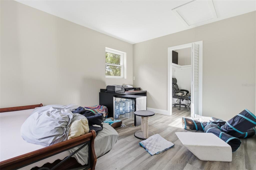 150 South Rooks Avenue Inverness, FL 34453 - Photo 12 of 30 a bedroom with furniture and a wooden floor