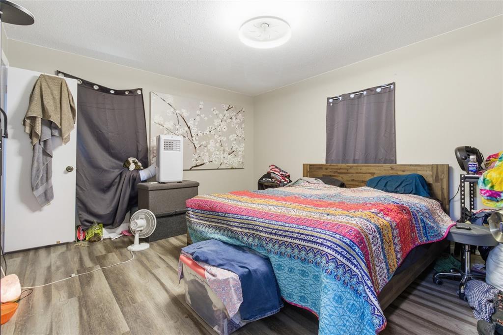 150 South Rooks Avenue Inverness, FL 34453 - Photo 16 of 30 a bedroom with bed and wooden floor