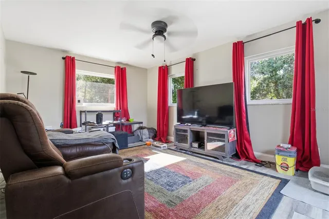 a bedroom with furniture and a window