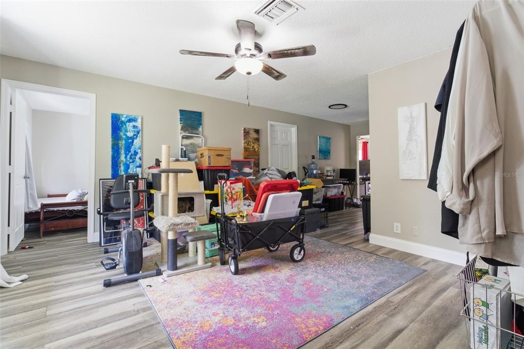 150 South Rooks Avenue Inverness, FL 34453 - Photo 9 of 30 a living room with furniture and a flat screen tv