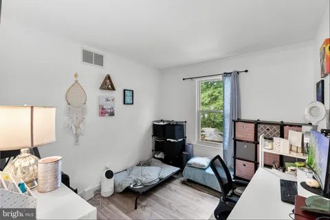 a bedroom with furniture and a window