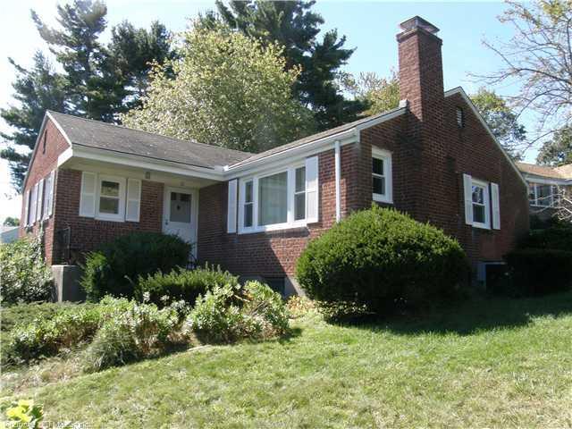 32 Gracewell Road Wethersfield, CT 06109 - Photo 1 of 1 a front view of a house with a garden