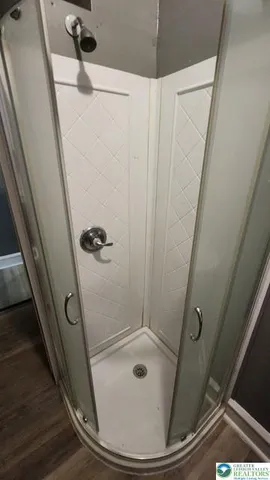 a bathroom with a granite countertop sink