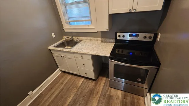 a kitchen with a stove and a microwave