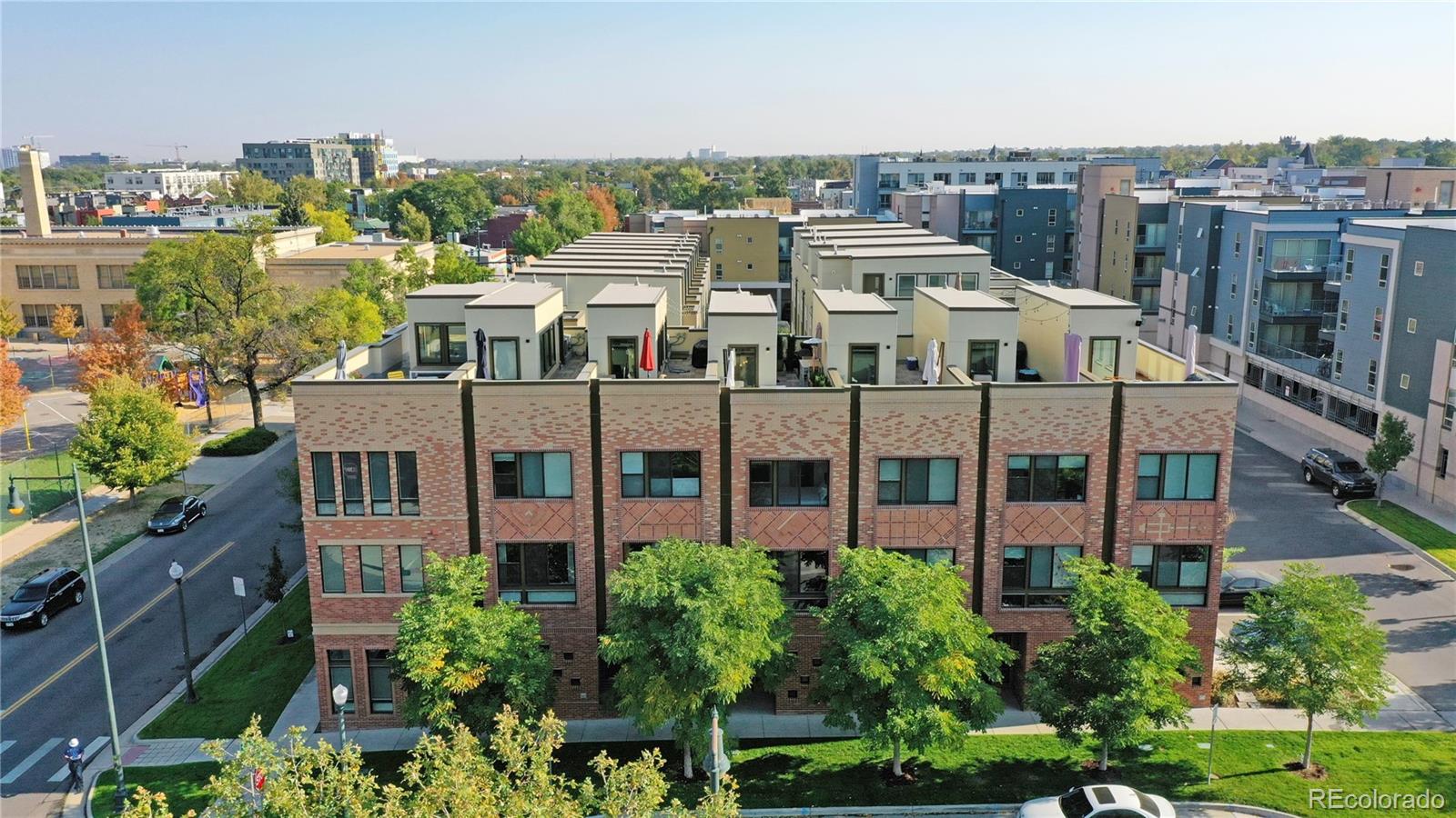 a view of a buildings in front of yard