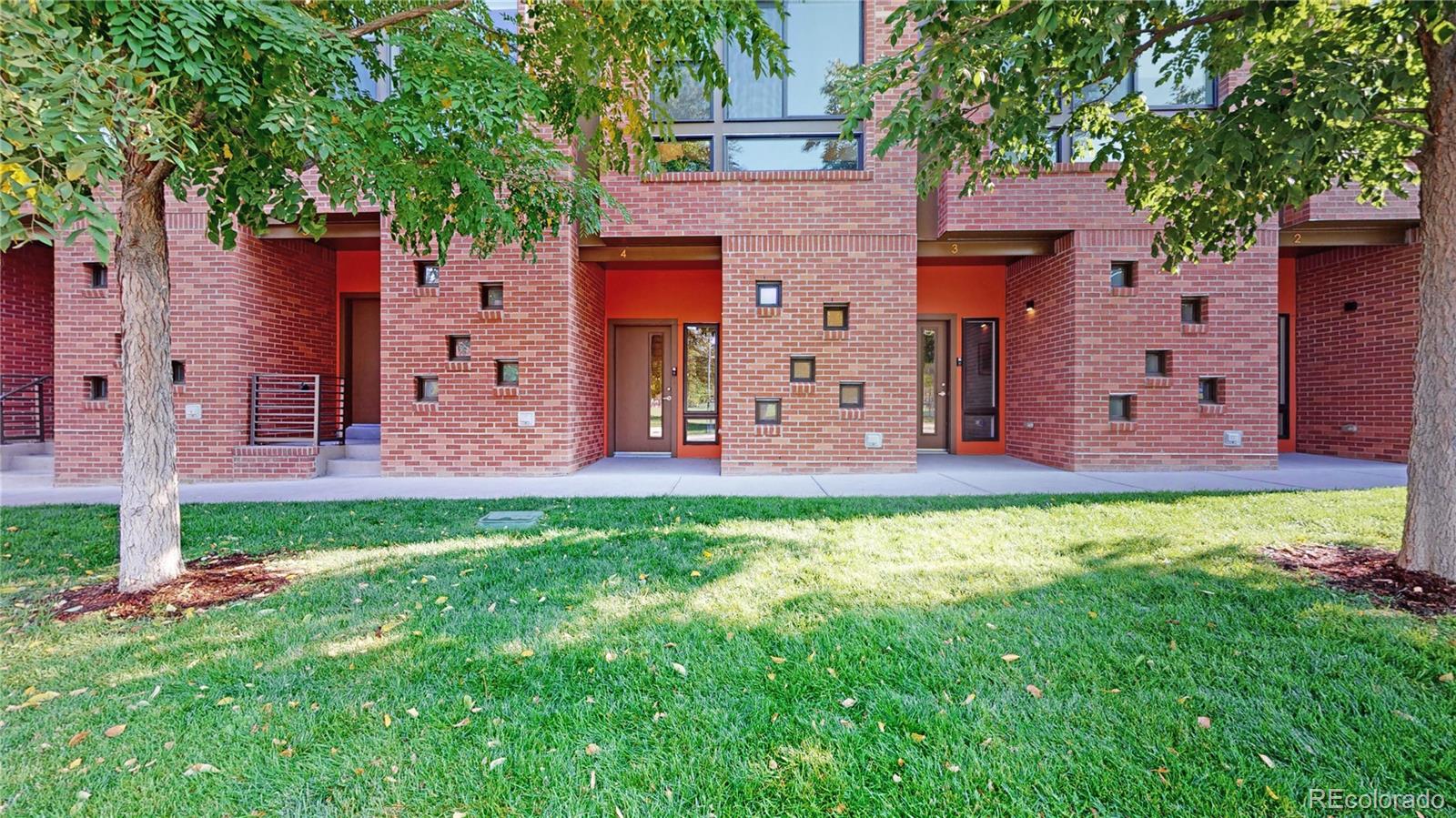 385 22nd Street, Unit 4 Denver, CO 80205 - Photo 28 of 40 front view of a house with a yard