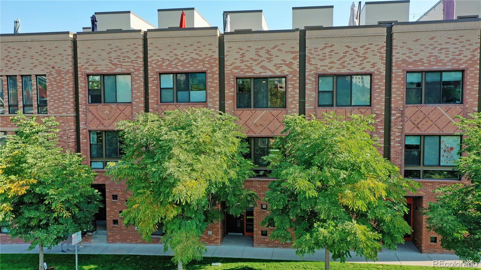 385 22nd Street, Unit 4 Denver, CO 80205 - Photo 3 of 40 front view of a brick house with a large windows
