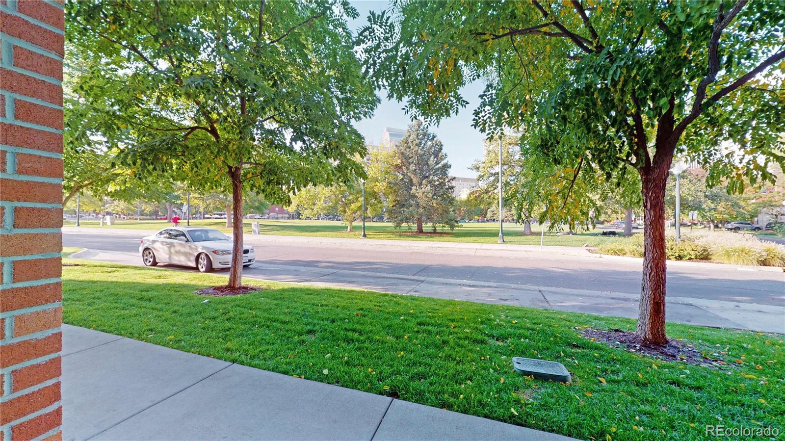 385 22nd Street, Unit 4 Denver, CO 80205 - Photo 31 of 40 a view of yard with green space and trees