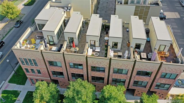 a view of an chairs and tables in the balcony