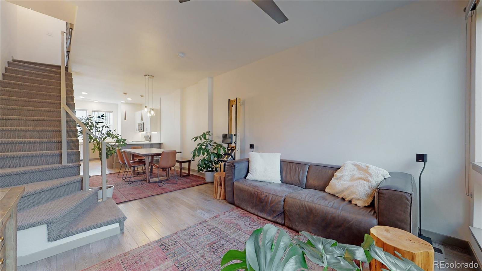 385 22nd Street, Unit 4 Denver, CO 80205 - Photo 6 of 40 a living room with furniture and wooden floor