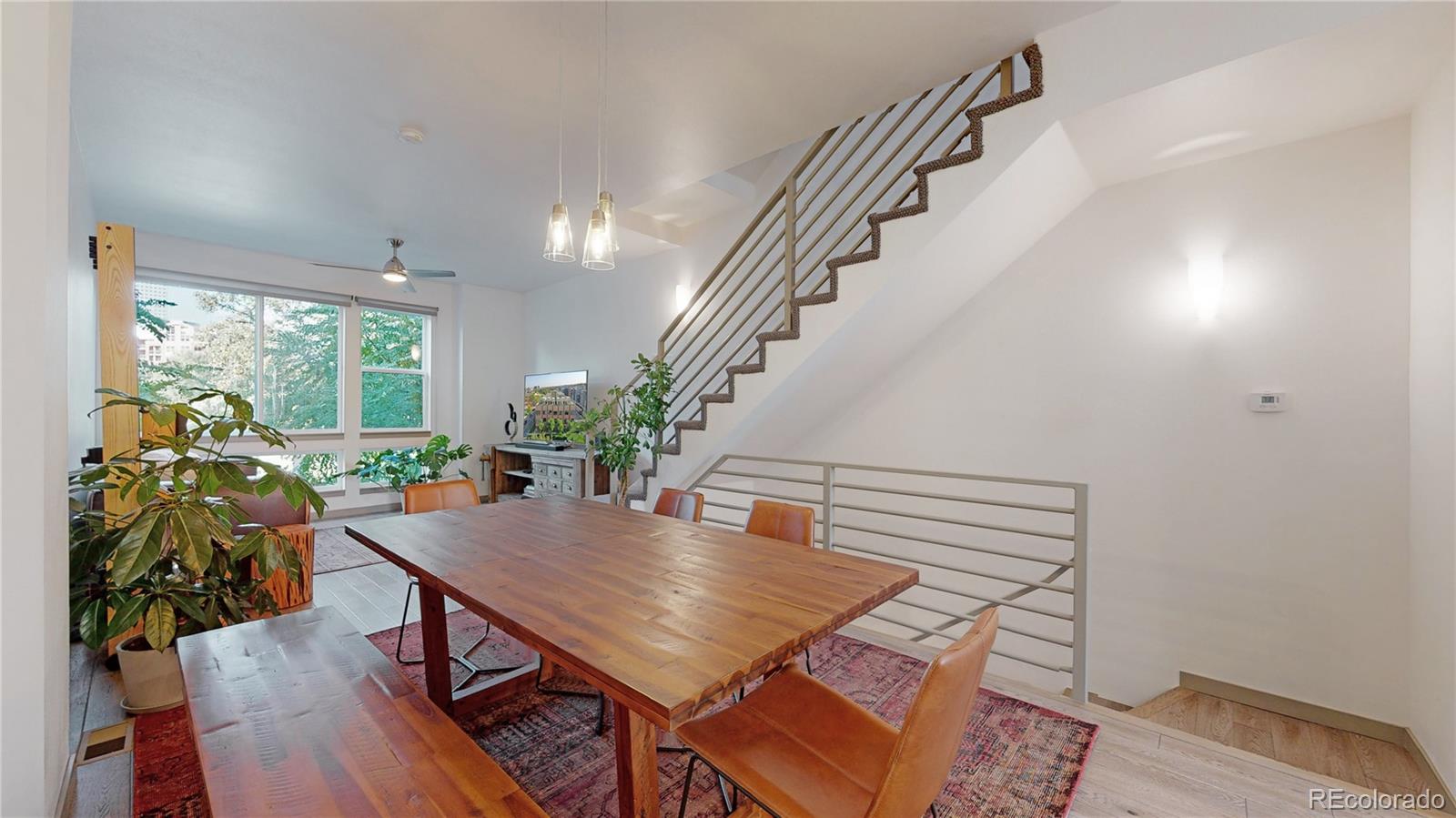 385 22nd Street, Unit 4 Denver, CO 80205 - Photo 10 of 40 a view of a dining room with furniture window and wooden floor