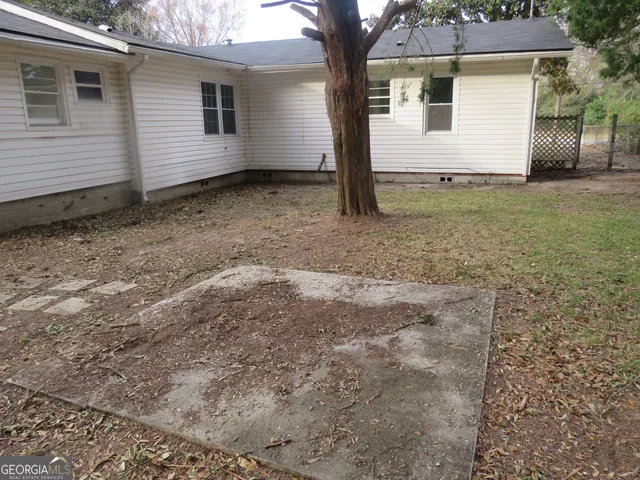 a view of a yard with trees