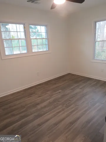 a close view of walk in closet with clothes