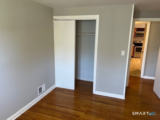 6 Cricket Drive Meriden, CT 06450 - Photo 13 of 33 a view of an empty room with wooden floor