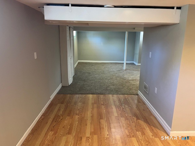 6 Cricket Drive Meriden, CT 06450 - Photo 29 of 33 wooden floor in a hallway
