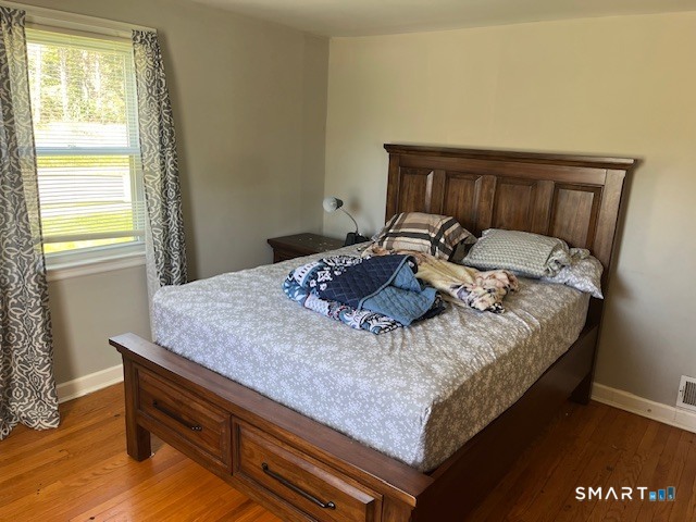 6 Cricket Drive Meriden, CT 06450 - Photo 10 of 33 a bed sitting in a bedroom next to a window