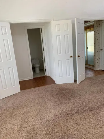 a bathroom with a shower and a mirror