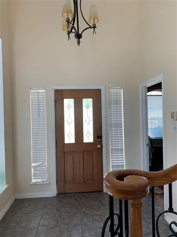 a view of a room with furniture and windows