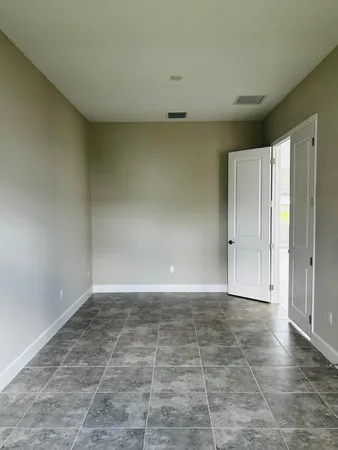 a bathroom with a glass shower door a sink and a bathtub