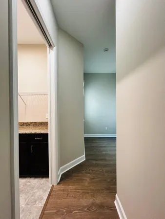 a view of entryway with wooden floor