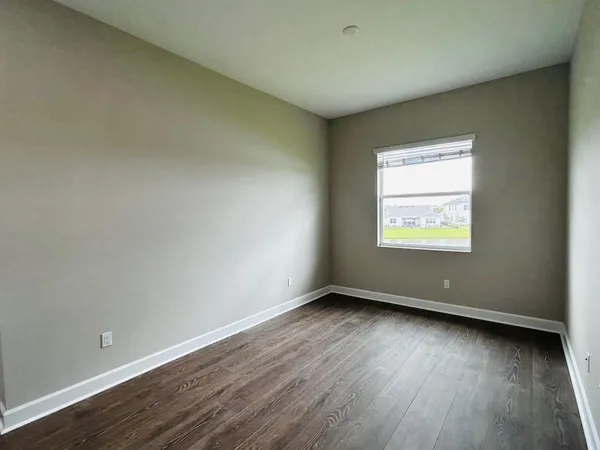 an aerial view of a house with a swimming pool