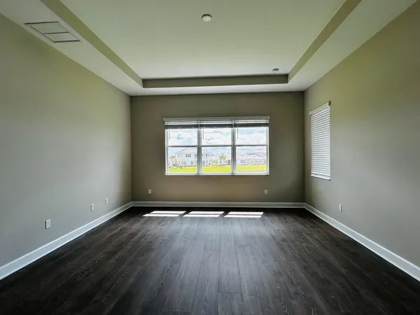 a view of a car park in front of house