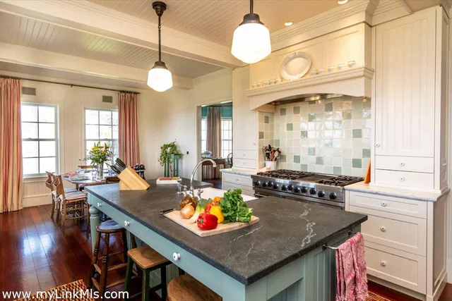 a outdoor dining space with furniture and window