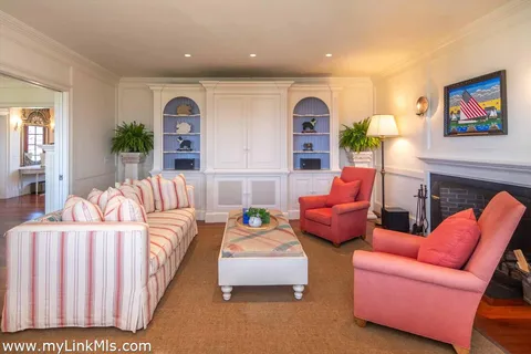 a bedroom with a bed and a large window with outer view