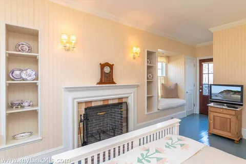 a bathroom with a sink a mirror and wooden floor