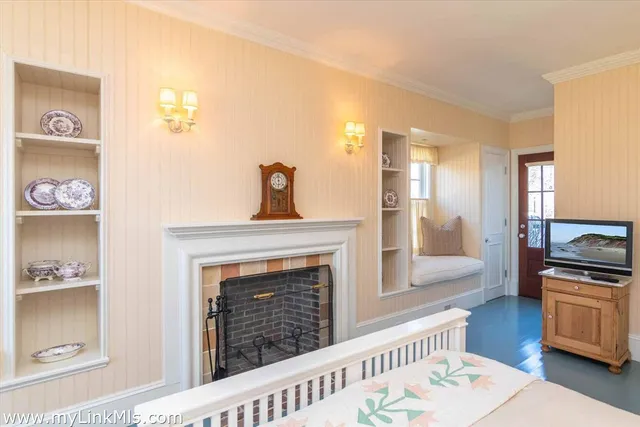 a bathroom with a sink a mirror and wooden floor