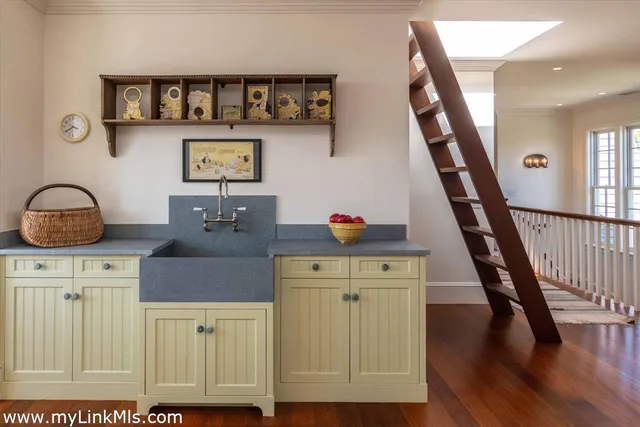 a bed sitting in a bedroom and chair