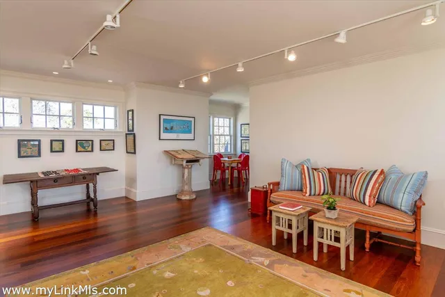a bedroom with a large bed and a large window