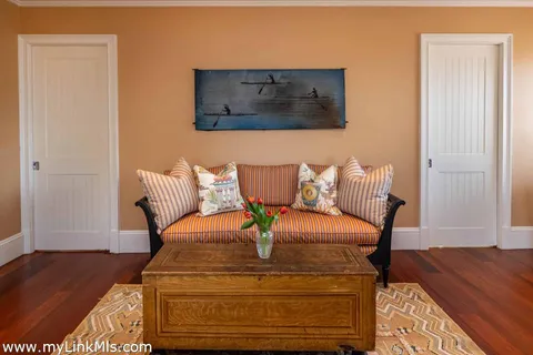 a bathroom with bathtub next to a window