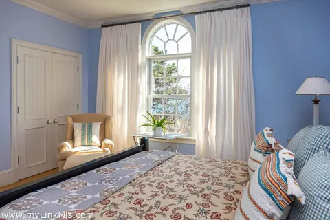 a view of a lake with houses in the background