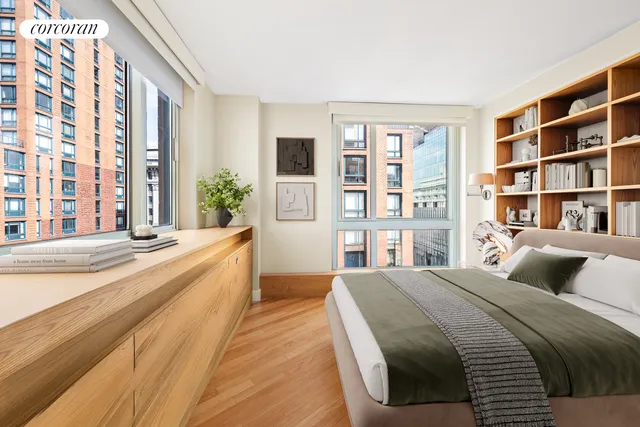 a spacious bedroom with a large bed and a large window