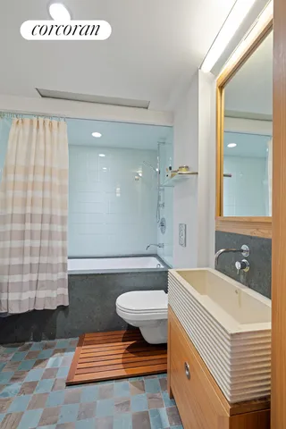 a large bedroom with a large bed and a large window