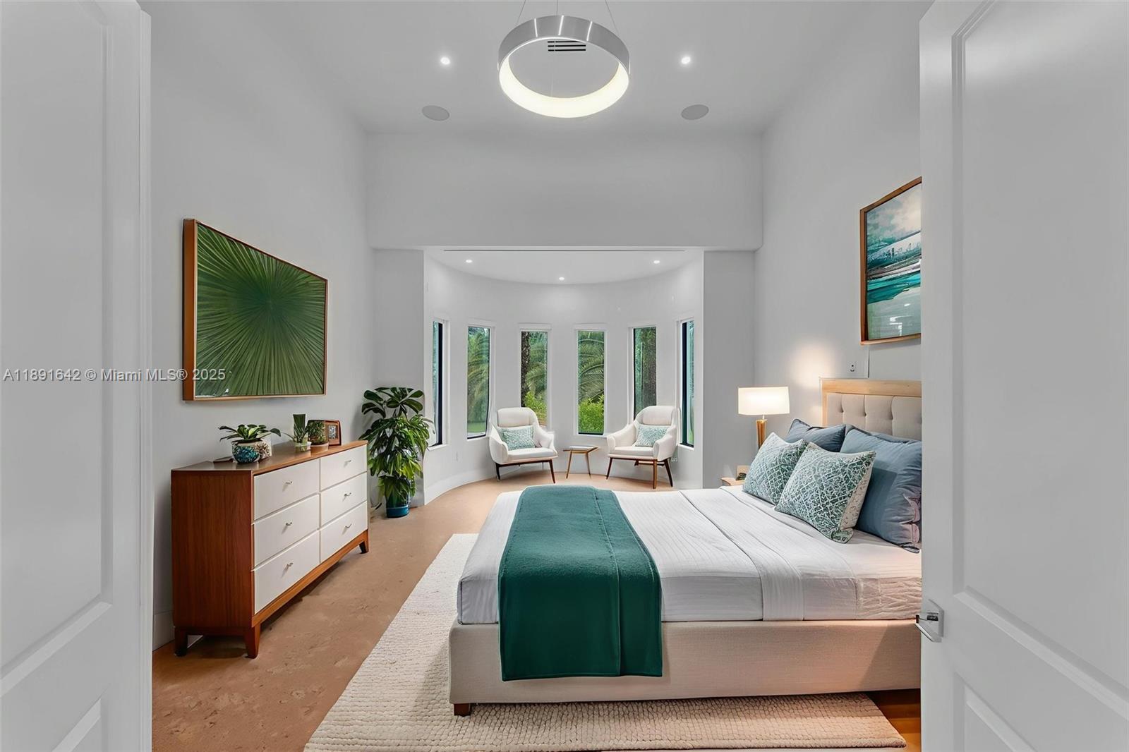 12175 Southwest 45th Street Miami, FL 33175 - Photo 12 of 58 a bedroom with a bed and a large window