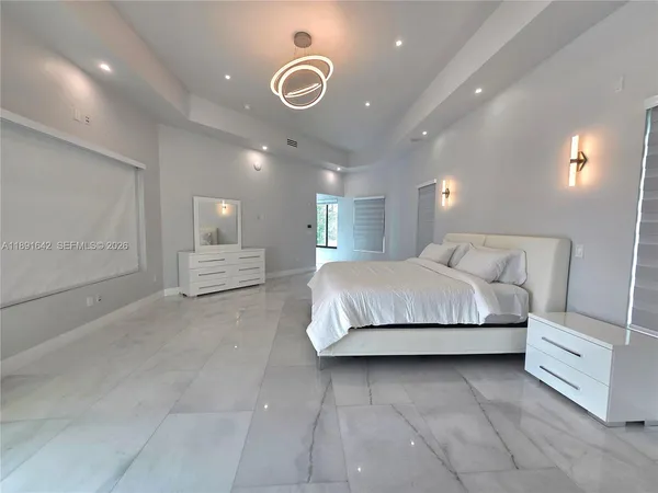 a view of a hallway with wooden shelves