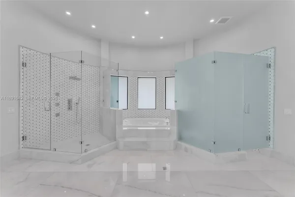 a large kitchen with stainless steel appliances lots of counter top space