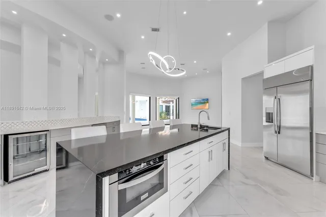 a kitchen with white cabinets