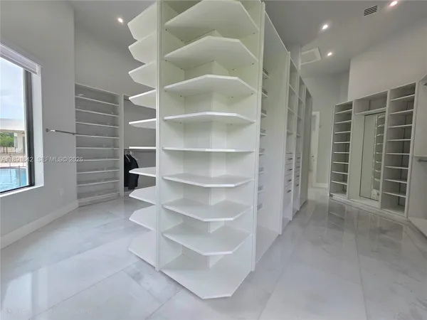 a utility room with sink dryer and washer