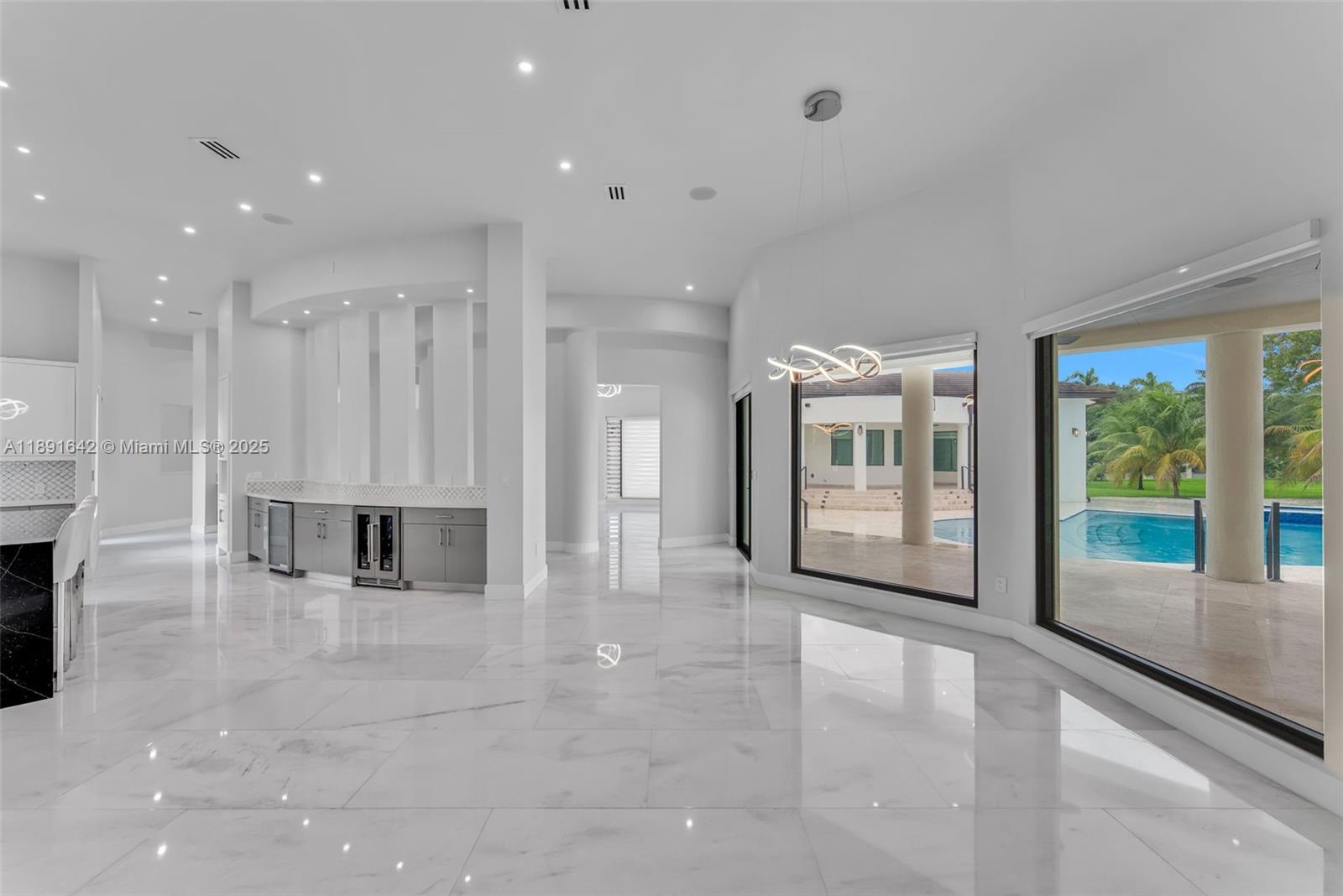 12175 Southwest 45th Street Miami, FL 33175 - Photo 31 of 58 a view of an empty room with a fireplace and a large window