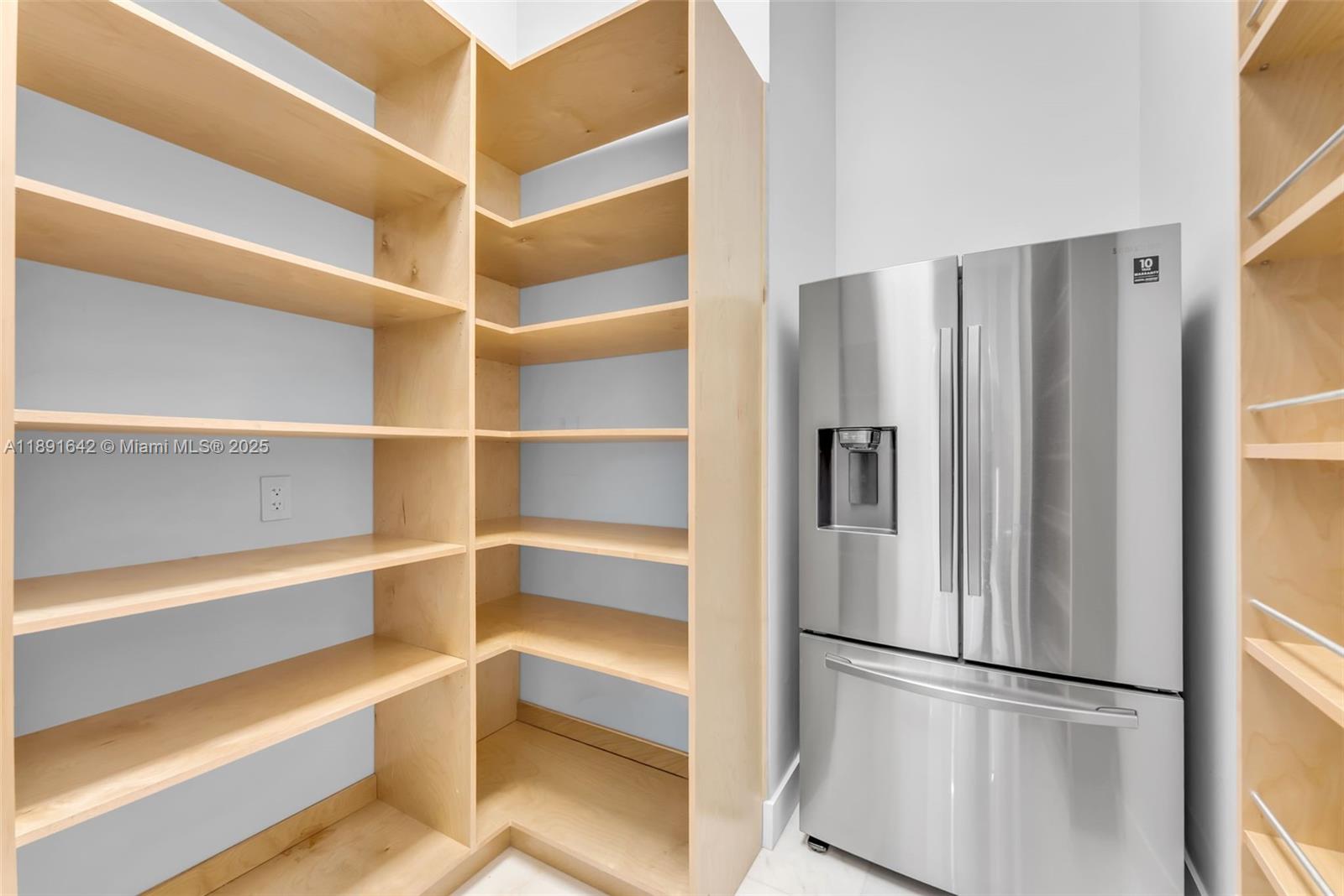 12175 Southwest 45th Street Miami, FL 33175 - Photo 32 of 58 a view of walk in closet with empty racks