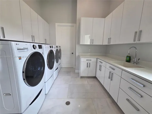 a room with a bed and a large window