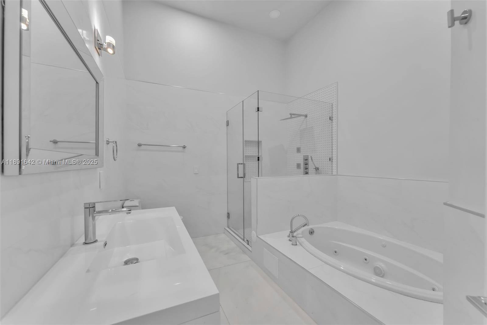 12175 Southwest 45th Street Miami, FL 33175 - Photo 42 of 58 a bathroom with a tub sink and mirror