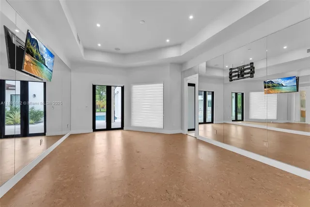 a view of an empty room with windows and yard