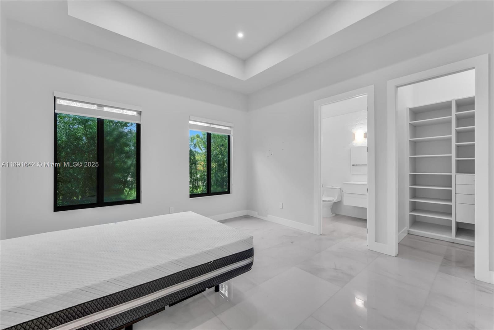 12175 Southwest 45th Street Miami, FL 33175 - Photo 46 of 58 a room with a bed and a large window