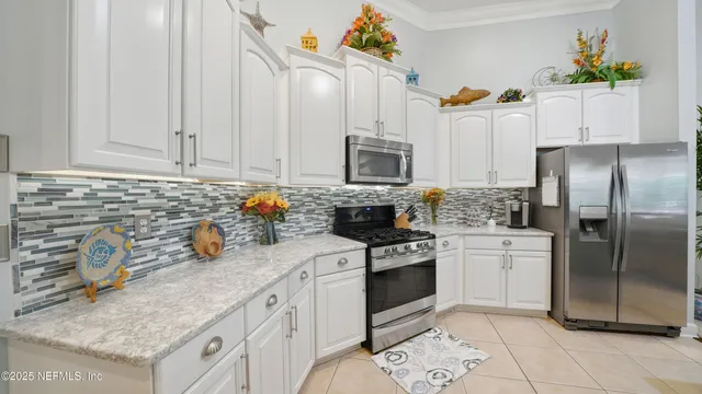 a bedroom with two beds and a window