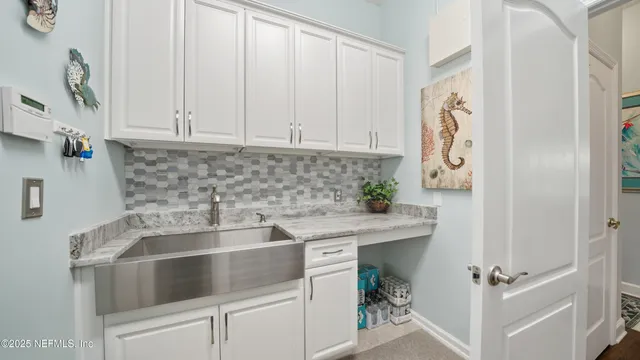 a view of a big yard with plants and large trees