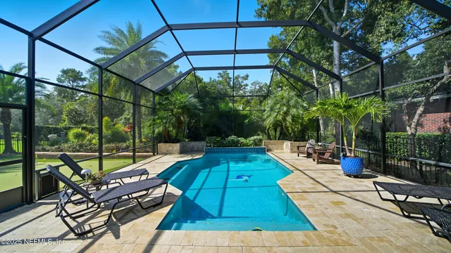 an aerial view of a house with a yard and garden